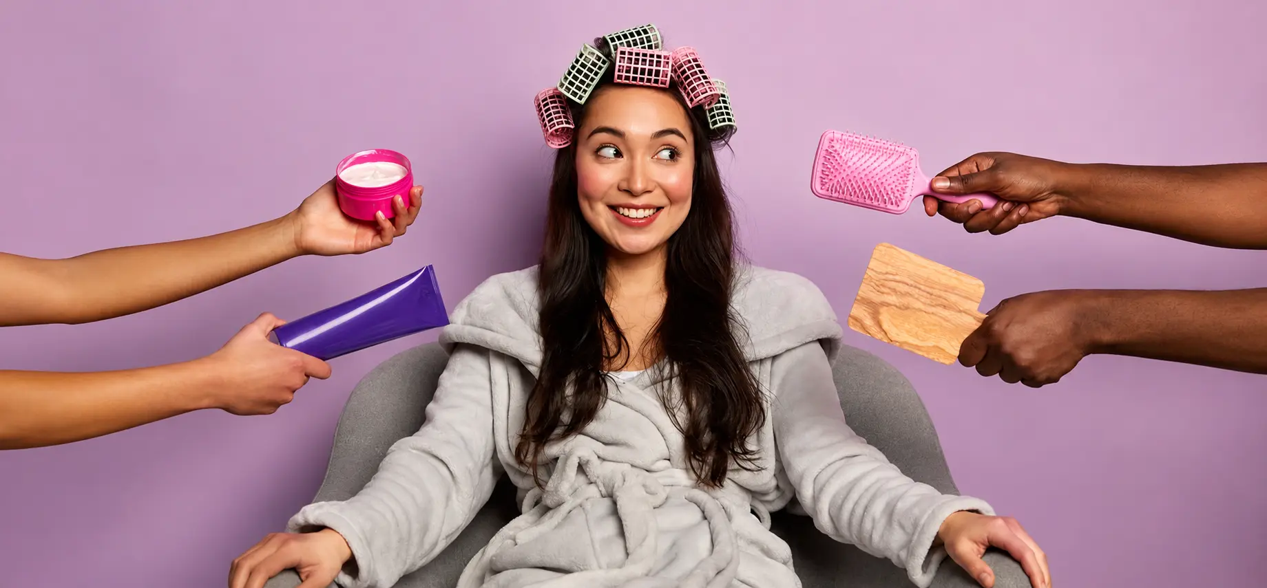 Woman following a step-by-step daily hair care routine with hair rollers, hair products, and styling tools to maintain healthy, shiny, and strong hair.